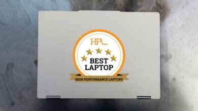 A closed silver laptop with a 'Best Laptop' award badge on its lid.