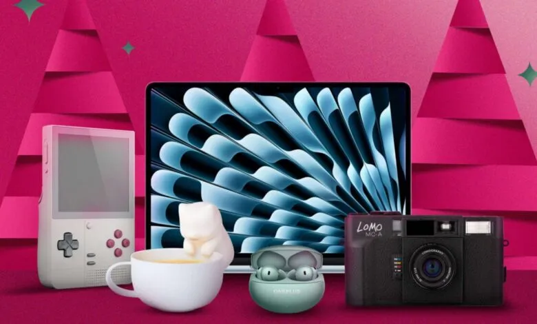 Collection of modern tech gadgets including a laptop, camera, earbuds, and retro gaming device.