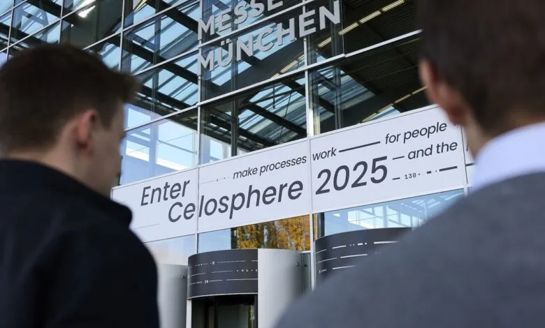 Two men look towards the entrance of Messe München, where a sign reads 'Enter Celosphere 2025'.