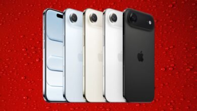 Five iPhones in different colors lined up against a red, water droplet background.