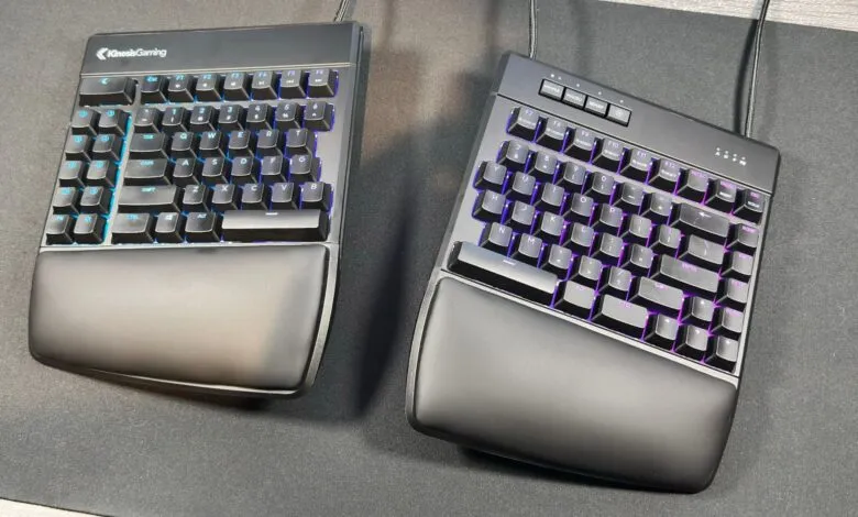 Two ergonomic gaming keyboards with RGB backlighting on a dark desk mat.