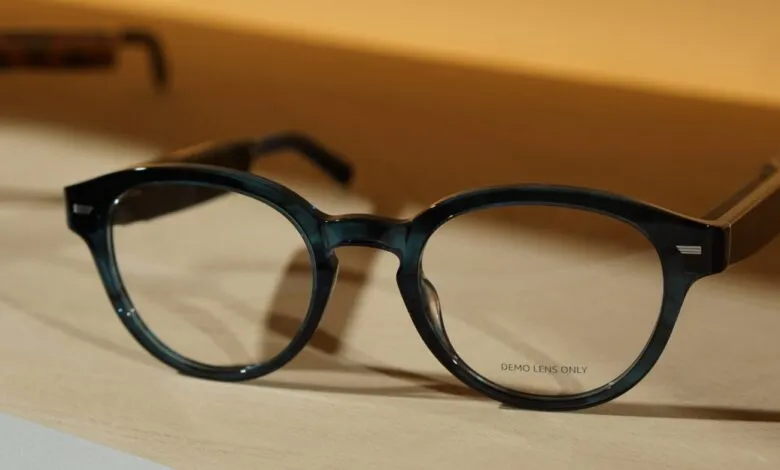 Close-up of stylish blue eyeglasses with clear demo lenses.