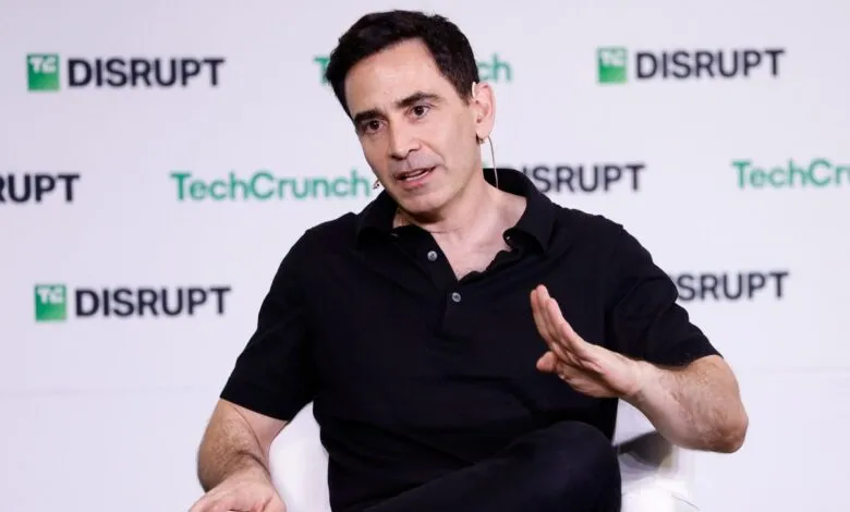 Elad Gil speaking on stage at TechCrunch Disrupt, wearing a black polo shirt.