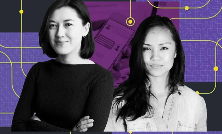 Two women pose against a tech-themed backdrop.