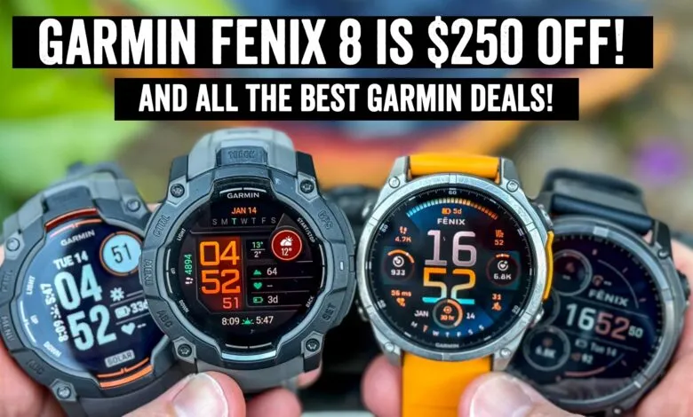 Close-up of four Garmin Fenix smartwatches with colorful displays showing fitness data.