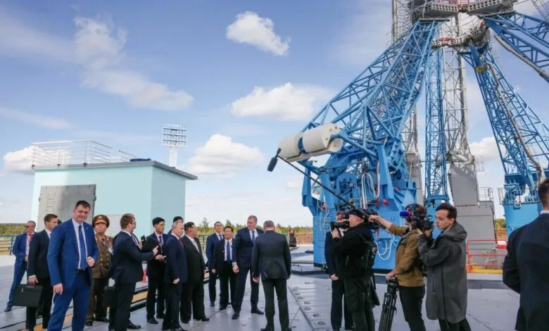 Vladimir Putin and Kim Jong Un at Vostochny Cosmodrome with media present.