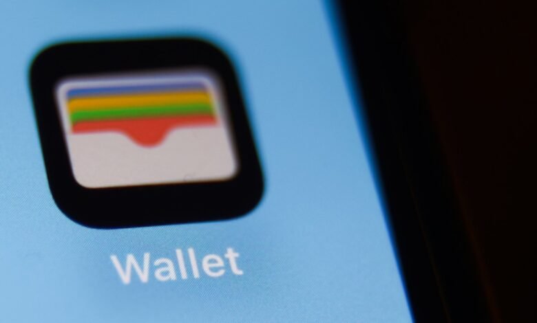 Close-up of the Apple Wallet app icon and text on a smartphone screen.