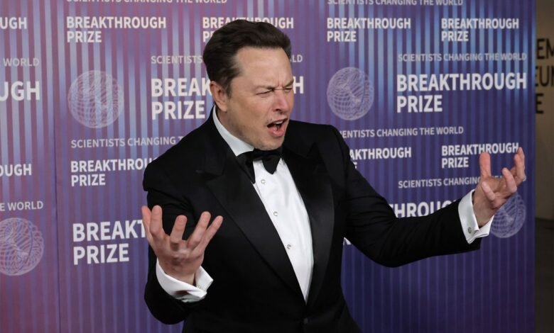 Elon Musk in a tuxedo gestures animatedly at the Breakthrough Prize event.