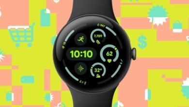 Close-up of a black Google Pixel Watch displaying fitness and time data.