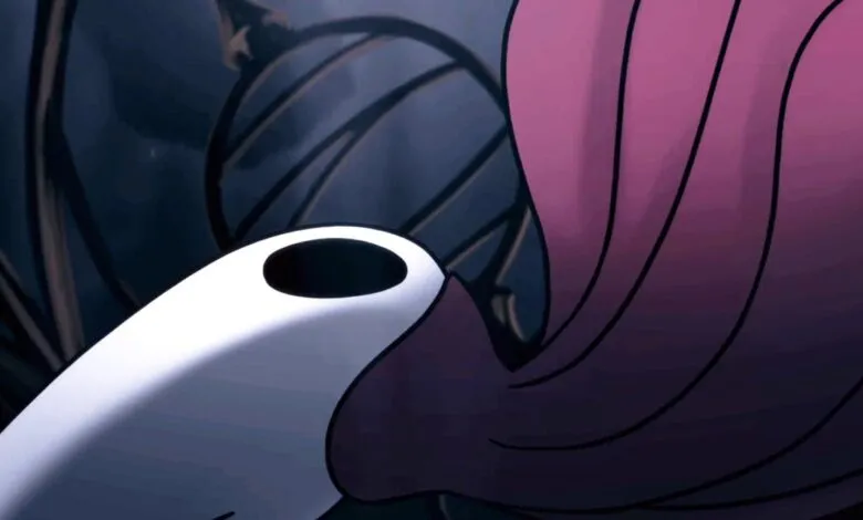 Close-up of Hornet from Silksong, falling through a dark, stylized environment.