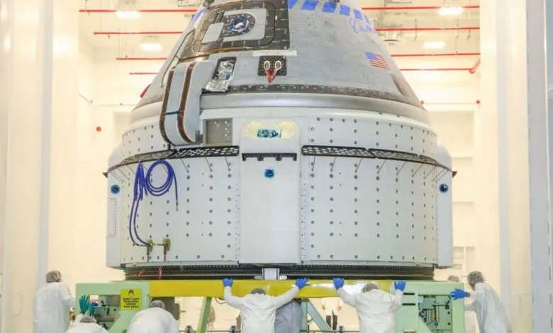 CST-100 Starliner spacecraft undergoing launch preparations.