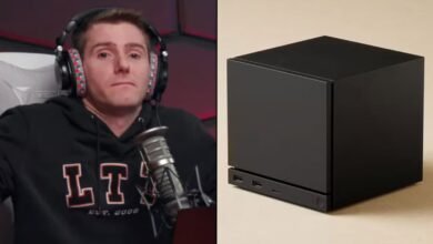 Linus Sebastian of Linus Tech Tips looking disappointed next to a small black computer.
