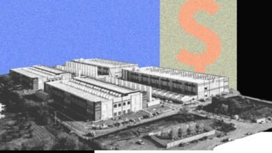 Aerial view of a large industrial complex with a dollar sign overlay.
