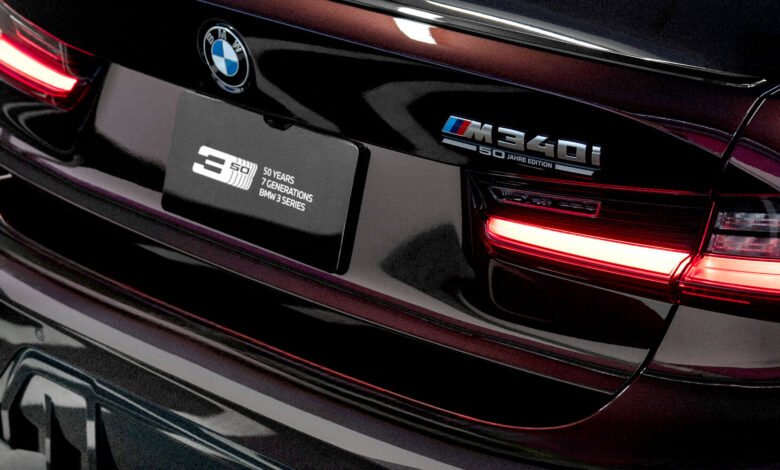 Close-up of the rear of a dark red BMW M340i, highlighting the '50 Jahre Edition' badge.