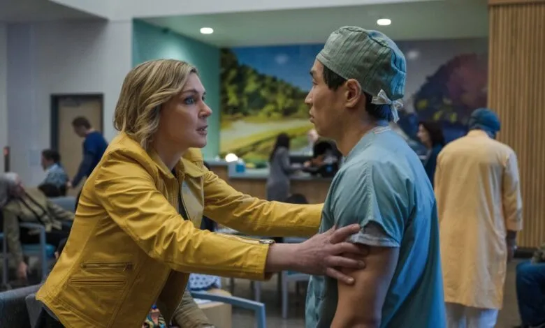 Woman in yellow jacket urgently speaks to a doctor in scrubs in a busy waiting room.