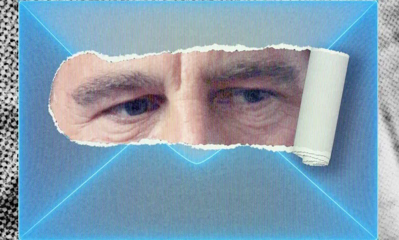 Close-up of a man's eyes peeking through a torn envelope with a blue background.