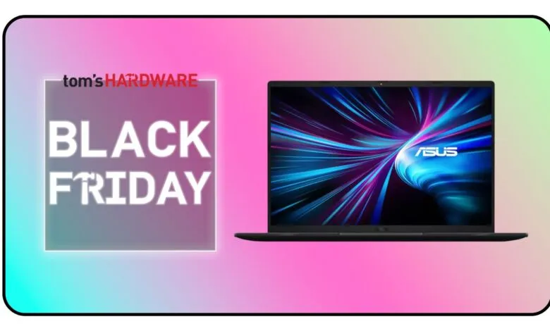 Asus laptop on display with Black Friday sale advertisement.