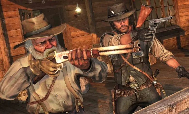 Two cowboys aiming rifles in a wooden building, one older with a white beard, the other younger with a bandana.