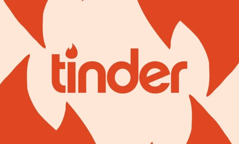 The Tinder logo with a flame icon above the 'i' on a light orange background.