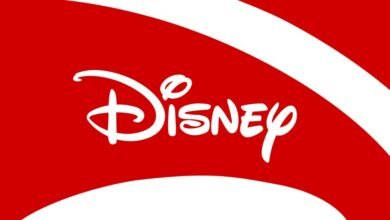 The iconic white Disney logo on a vibrant red background with white curved lines.
