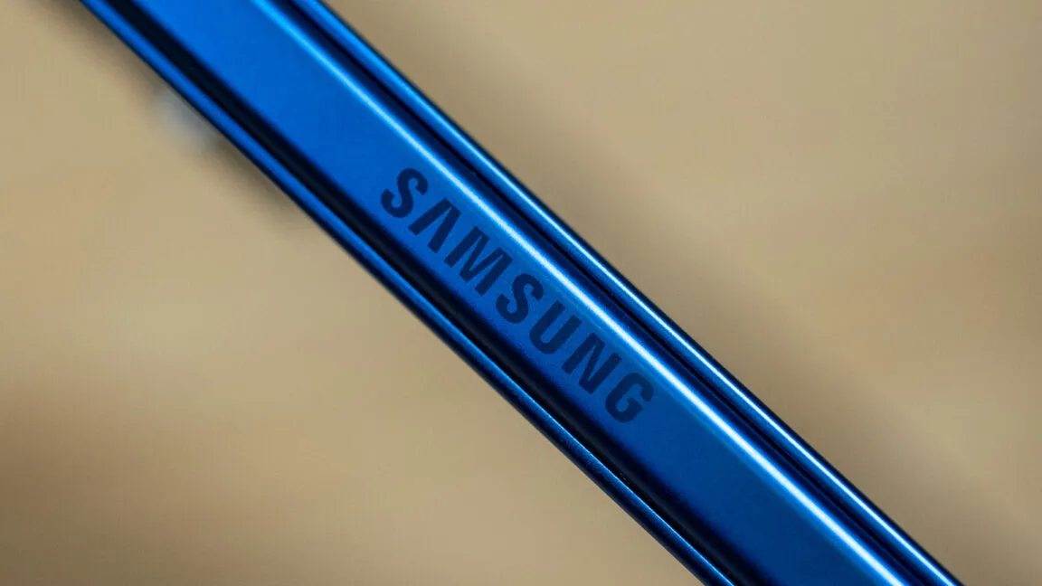 Close-up of the blue Samsung logo etched onto a metallic surface.