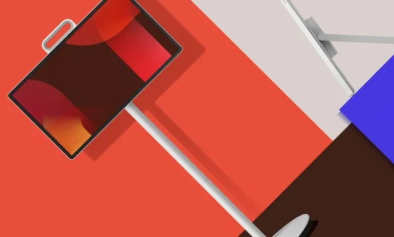 A modern, minimalist display screen with a red and orange abstract graphic.