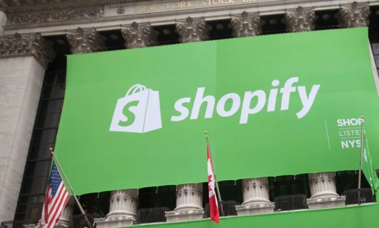 Shopify logo banner displayed on the New York Stock Exchange building.