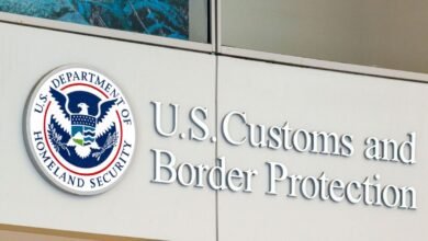 Close-up of the U.S. Customs and Border Protection building sign with its official seal.