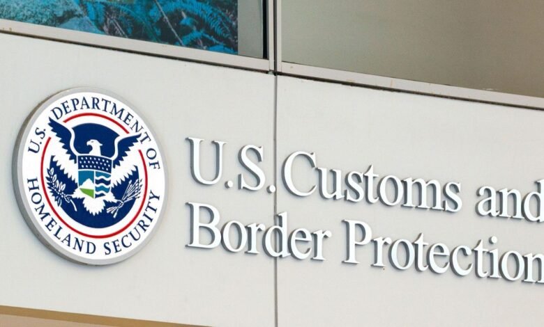 Close-up of the U.S. Customs and Border Protection building sign with its official seal.