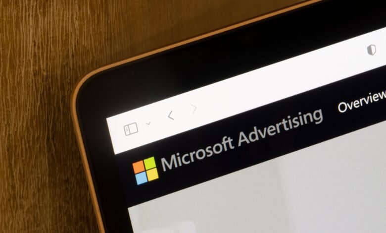 Close-up of a tablet screen displaying the Microsoft Advertising dashboard.