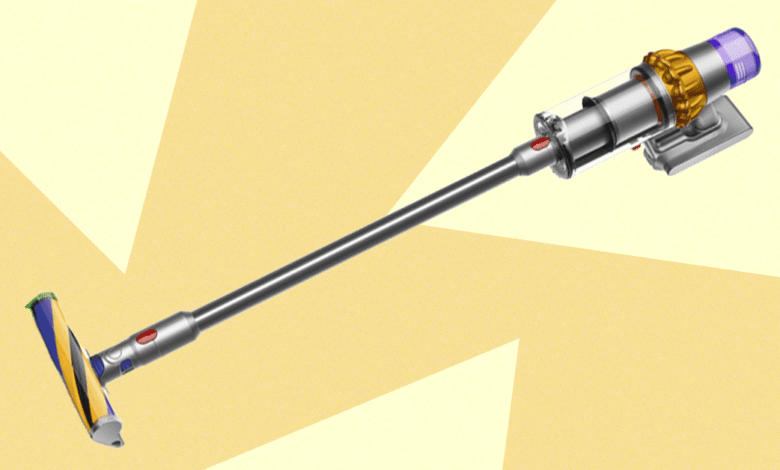 A sleek Dyson cordless vacuum cleaner with a silver body and yellow accents.