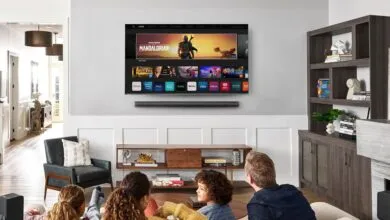 Family watches 'The Mandalorian' on a Vizio smart TV in a modern living room.