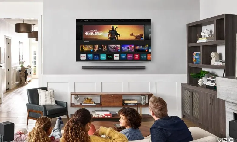 Family watches 'The Mandalorian' on a Vizio smart TV in a modern living room.