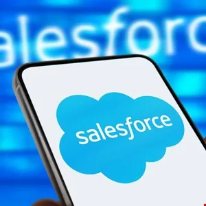 Close-up of a smartphone displaying the Salesforce logo on its screen.