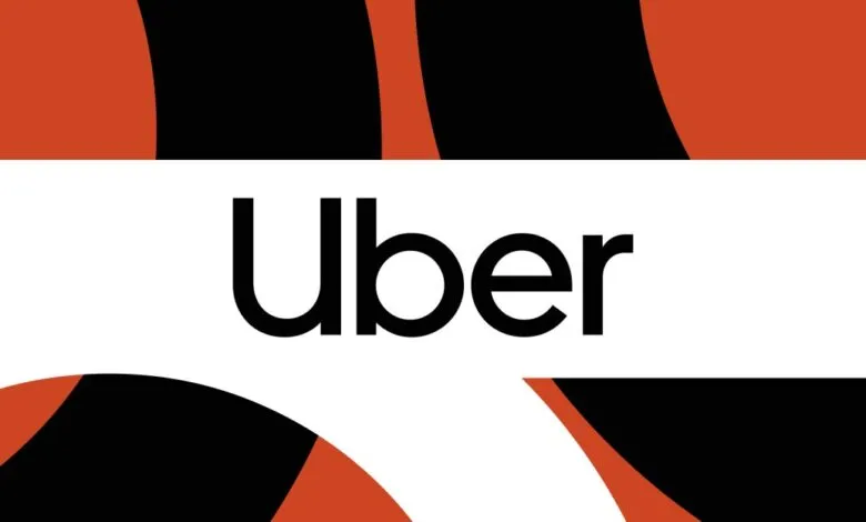 The Uber logo in black text on a white background, with abstract orange and black shapes.