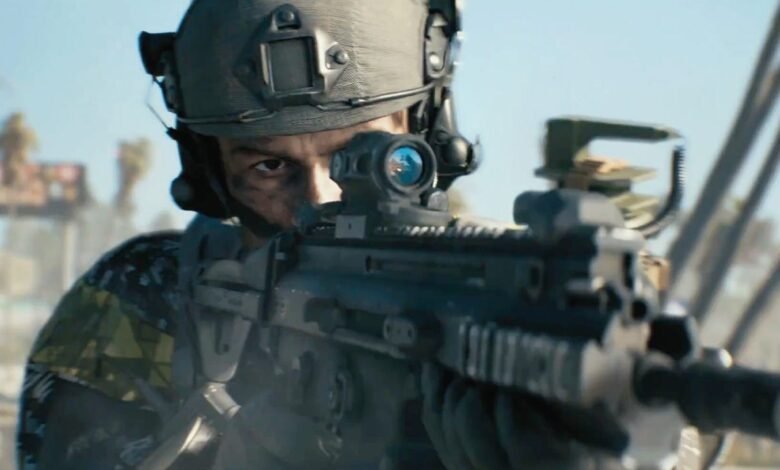 Soldier aiming a rifle with a scope, wearing a helmet and camouflage.