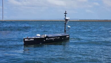 Autonomous research vessel 'Bellona' with solar panels on the water.
