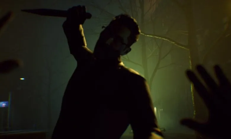 Silhouetted figure with knife raised in a dark, foggy outdoor setting.