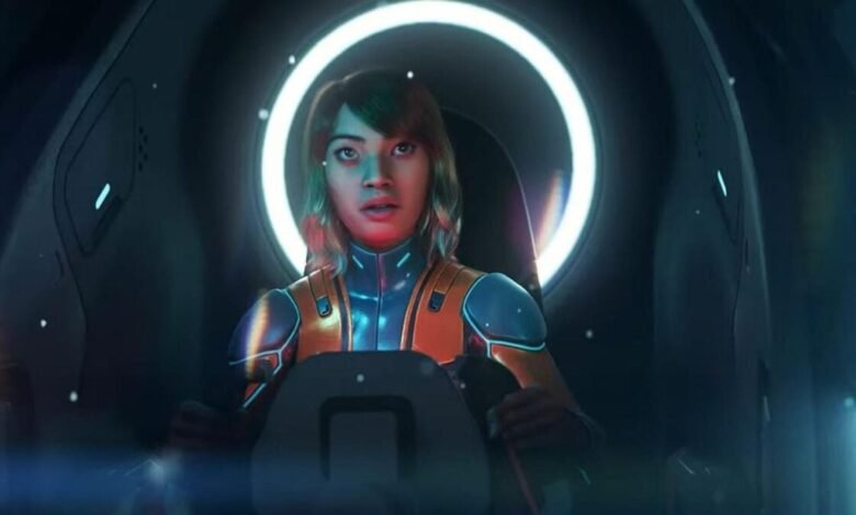 Young woman in futuristic orange and blue pilot suit inside a spaceship cockpit.