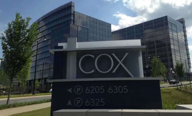 Cox Communications building exterior with parking directions.
