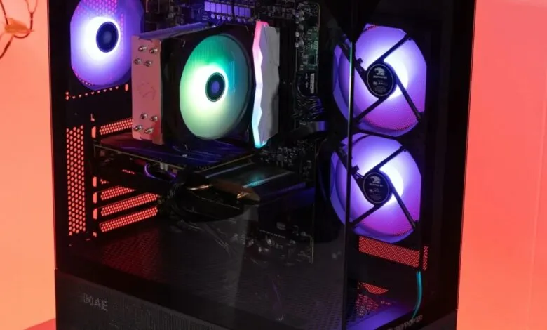 Custom gaming PC with RGB lighting visible through a glass side panel.