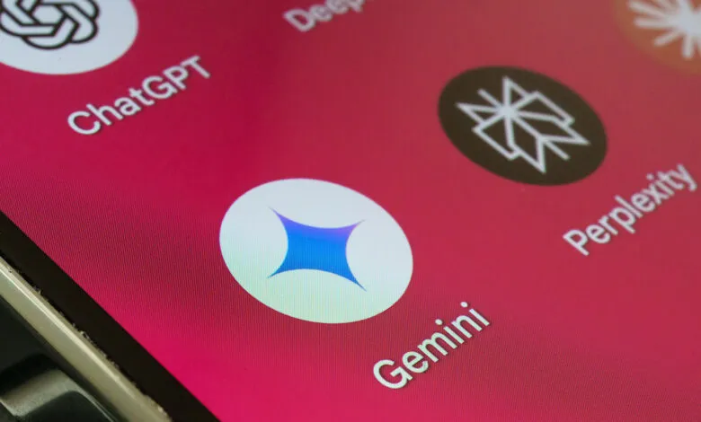 Close-up of a smartphone screen displaying AI app icons including Gemini, ChatGPT, and Perplexity.
