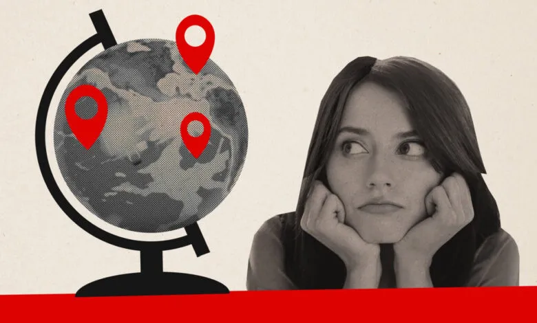 Woman gazes at globe marked with red location pins, pondering international expansion.