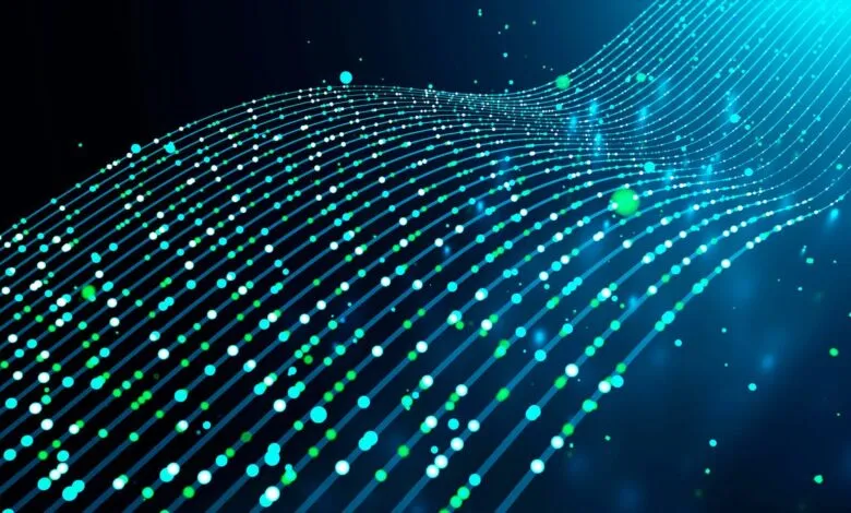 Abstract digital network of glowing blue and green dots on dark background