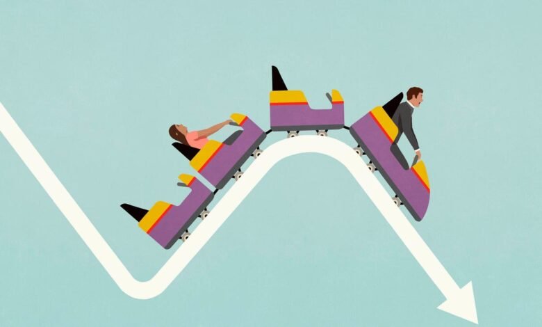 People on a roller coaster descending a graph representing financial decline.