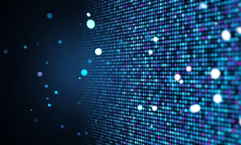 Abstract digital grid of blue and purple dots with glowing white and cyan particles.