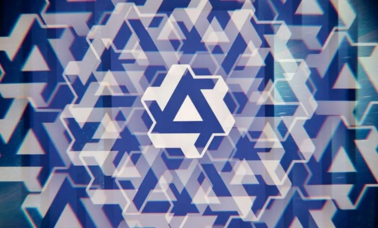 Abstract geometric pattern of blue and white triangles and hexagons.