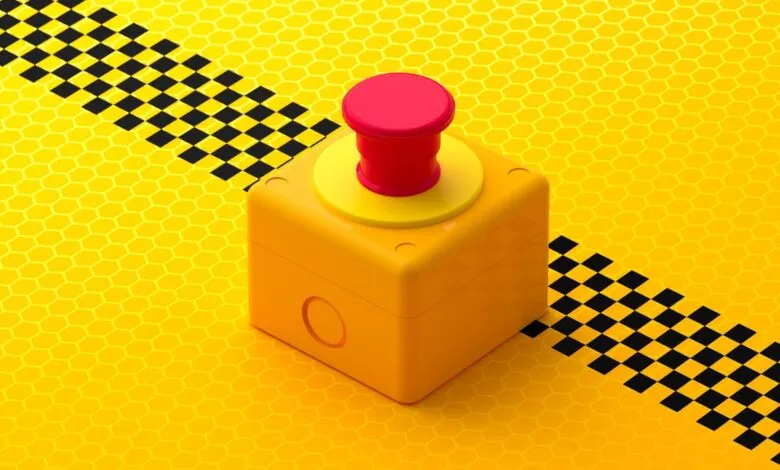 A bright yellow cube with a red emergency stop button on a yellow honeycomb background.