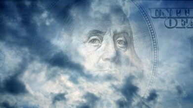 Benjamin Franklin's portrait from a hundred-dollar bill superimposed over stormy clouds.