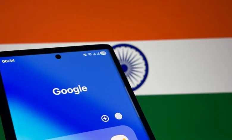 Smartphone displaying Google logo with the Indian flag in the background.